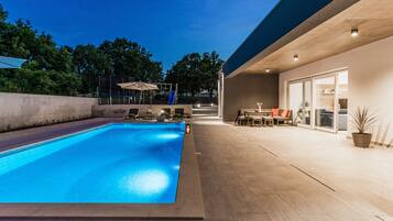 Outdoor pool, a heated pool, sun loungers