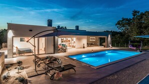 Outdoor pool, a heated pool, pool loungers