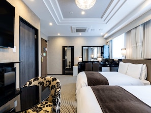 A hotel room with a large bed, a desk with a chair, a television, and a mirror. - APA Hotel & Resort Midosuji Hommachi Ekimae Tower (Osaka)
