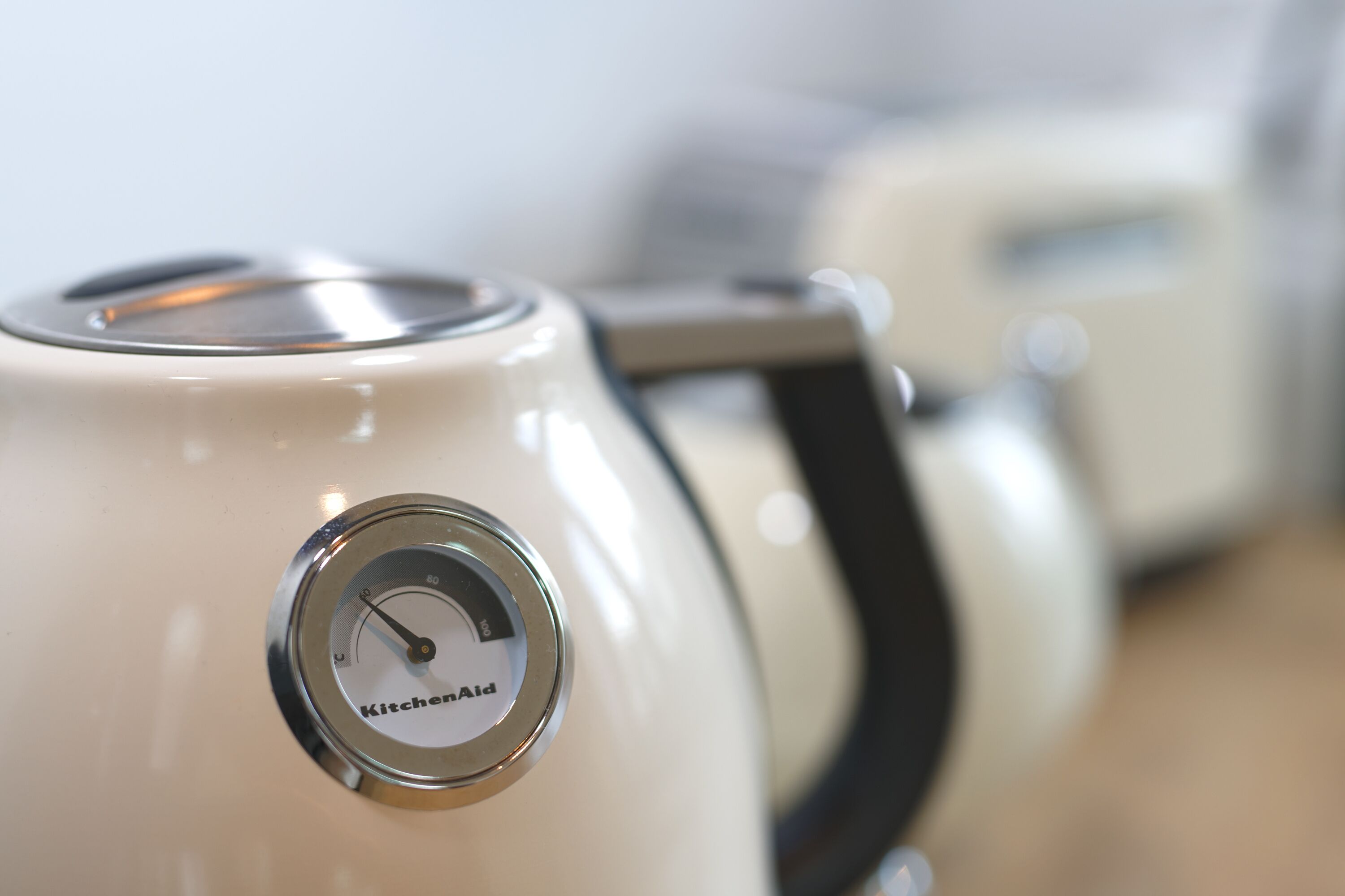A close-up of a KitchenAid appliance with a dial and brand name visible.
