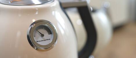 A close-up of a KitchenAid appliance with a dial and brand name visible.