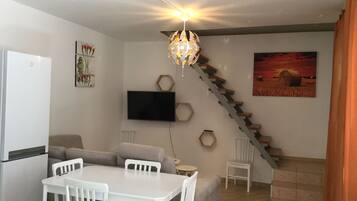 Apartment, 2 Bedrooms | Living room | 49-inch flat-screen TV with satellite channels, TV, Netflix