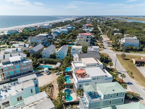 A coastal residential area with houses, a beach, and a swimming pool. - 2 Rooftop Decks | Downtown IOP | Pool | Elevator | 1 Blk From Beach | Pets (Isle of Palms)
