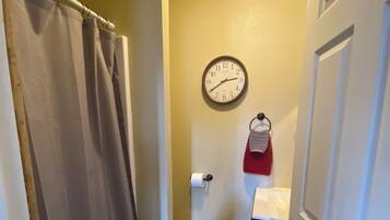 Shower, hair dryer, towels, toilet paper