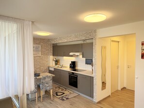 Fridge, microwave, oven, dishwasher - Apartment 05 with balcony and view of the Bodden - MR: Haus Inselperle with view of the (Mönchgut)