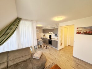 Interior - Apartment 05 with balcony and view of the Bodden - MR: Haus Inselperle with view of the (Mönchgut)