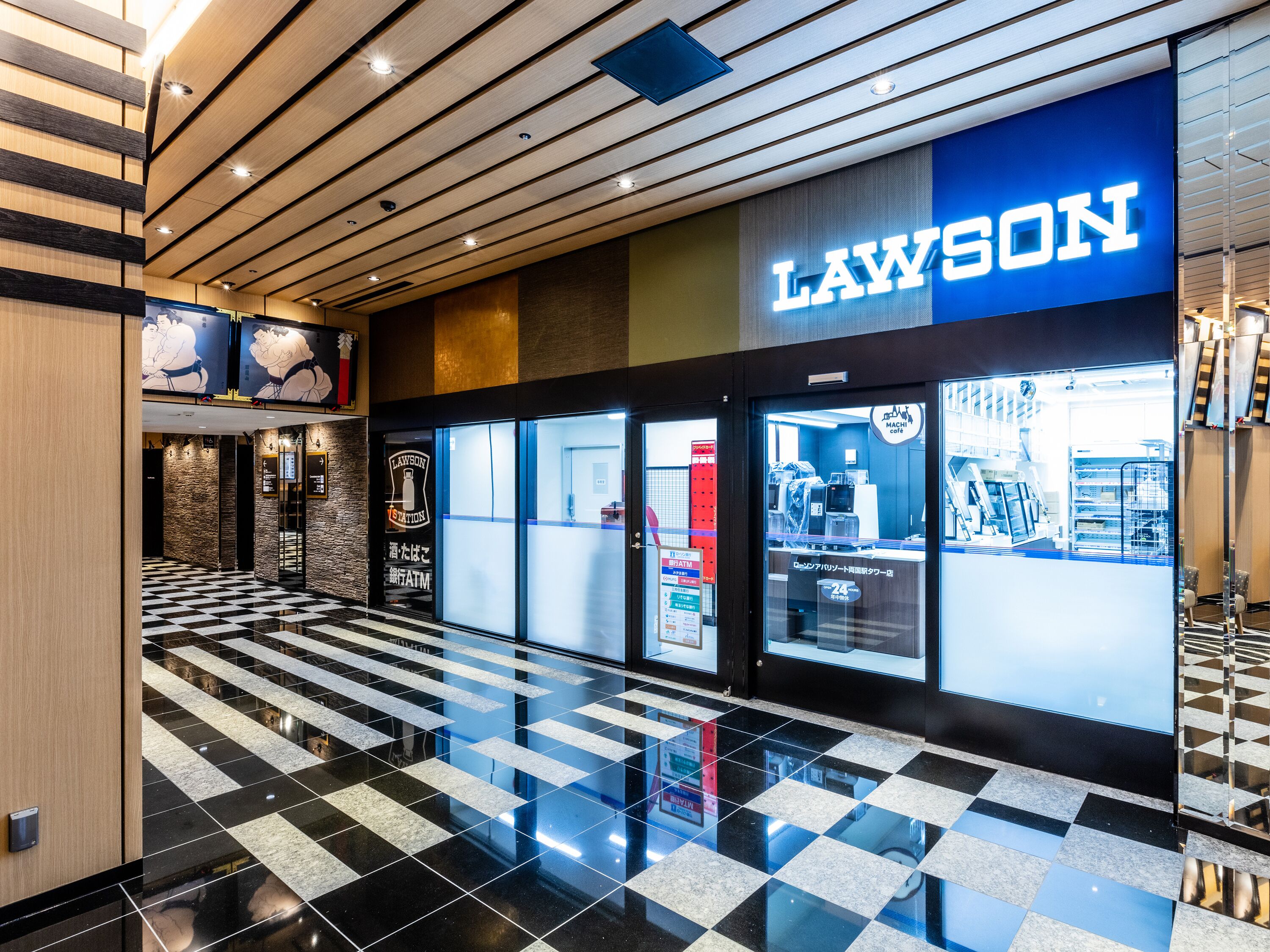 A modern Lawson store with a checkered floor and a prominent blue sign.