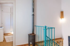 A staircase with a blue handrail, a metal pipe, and a trash can. - Family Country House with Pool in Andratx (Port Andratx)