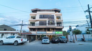 A multi-story building with a ground-level shop named "The Eastern Star" and a pet store called "Pet Essentials."