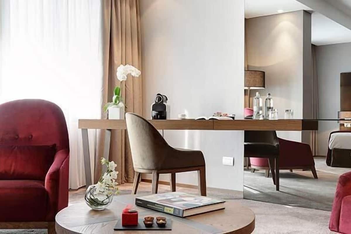 grand premium room | living area | 42-inch flat-screen tv with satellite channels, tv