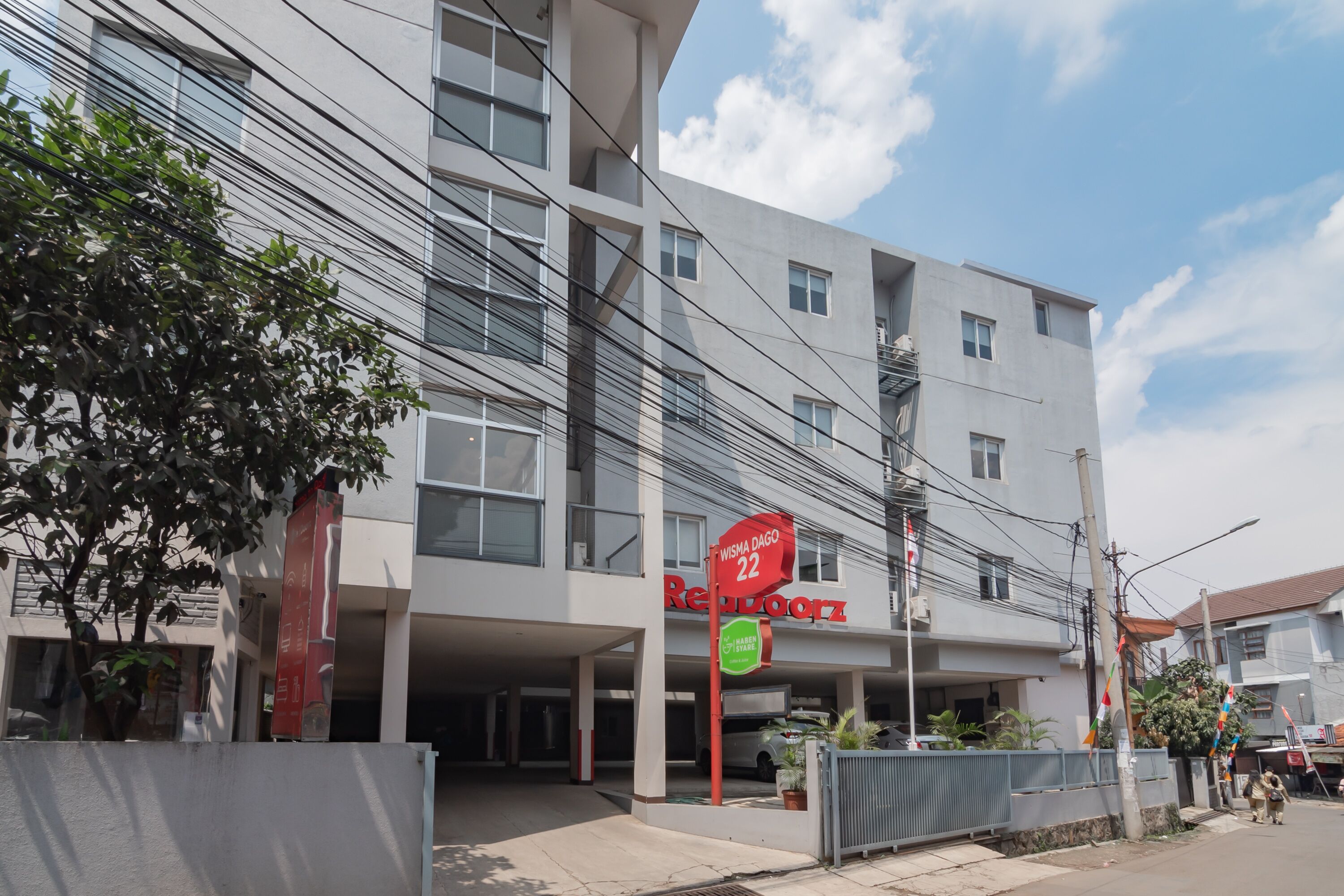 A modern building with a sign indicating room number 22.
