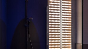 A modern bathroom with a glass-enclosed shower, a visible window with blinds, and a toilet. - Montedonzelli B&B (Naples)