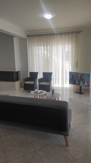 Apartment, 2 Bedrooms, Sea View (2) | Living area | 32-inch flat-screen TV with digital channels, TV - Agriomata Vergas Apartments (Kalamata)