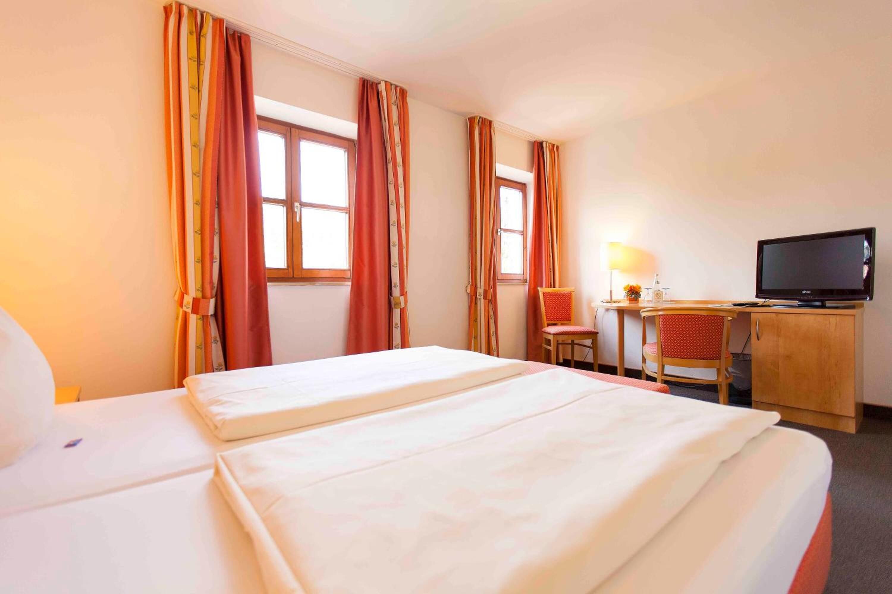 desk, laptop workspace, blackout curtains, iron/ironing board