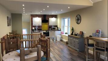 Deluxe Cottage, 2 Bedrooms, Non Smoking | Living area | Flat-screen TV, DVD player