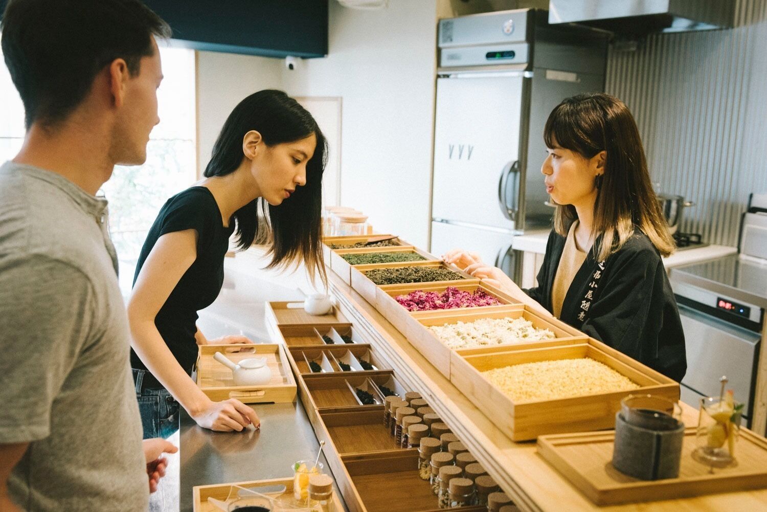 A kitchen counter with various food items and a coffee machine.
