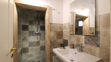 Double Room | Bathroom | Shower, hair dryer, bidet, towels