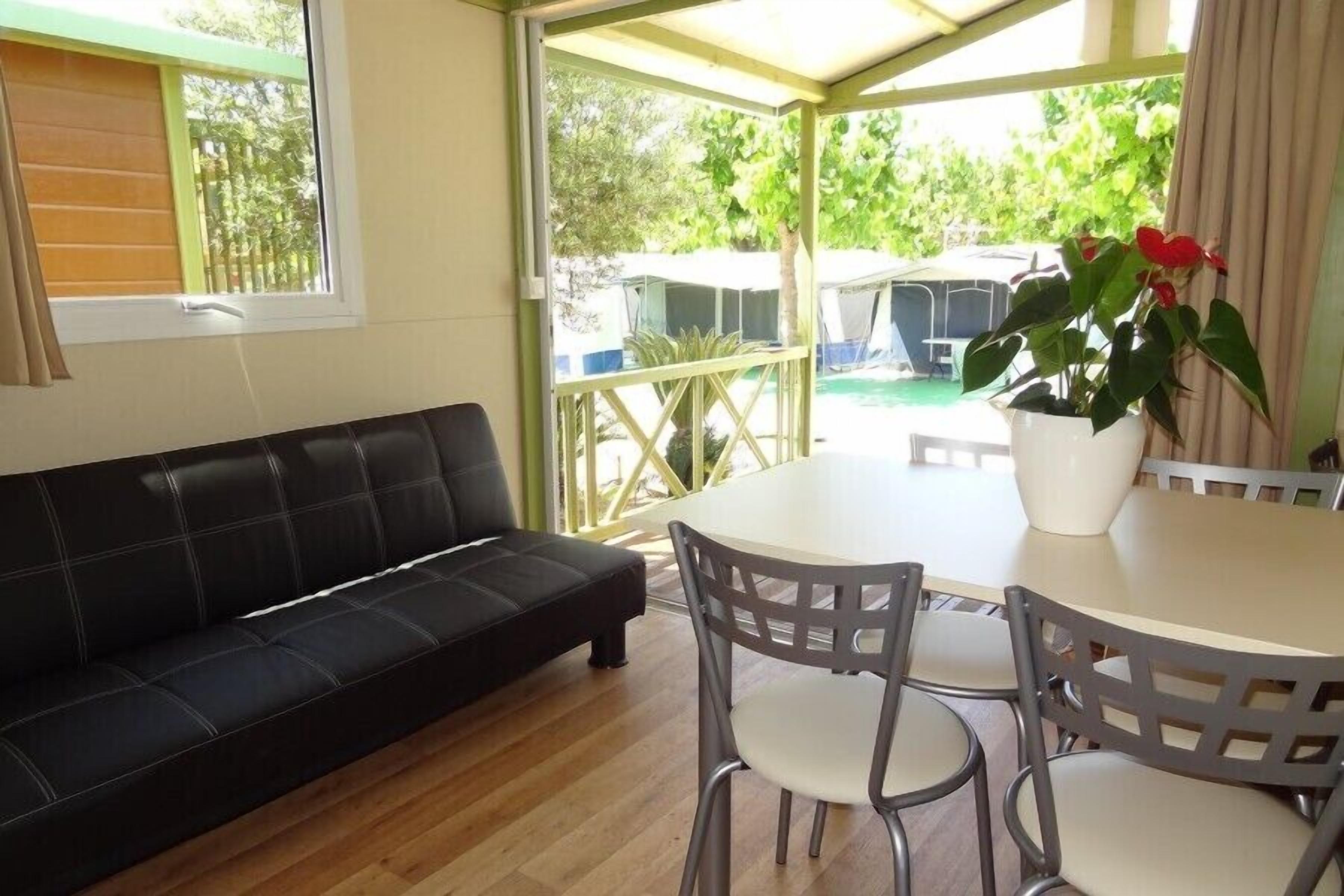 Bungalow, Garden View | Living area | Flat-screen TV