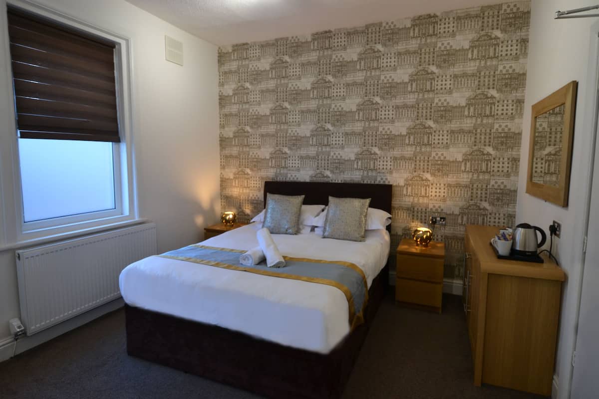 Tweepersoonskamer, en-suite badkamer | 1 slaapkamer, wifi