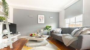 Departamento Deluxe, 2 habitaciones | Área de sala de estar