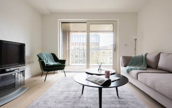 Basic Apartment, Multiple Beds | Living room | Flat-screen TV