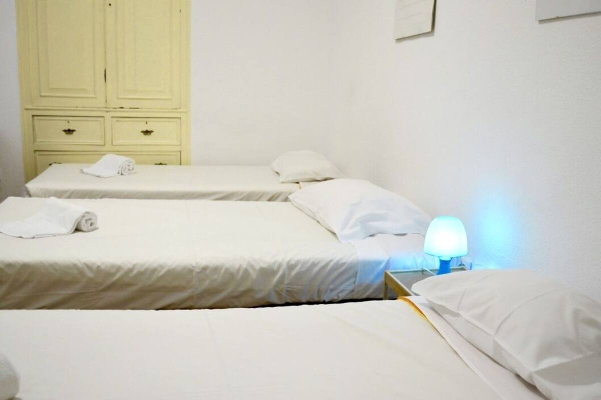 Economy Triple Room, Private Bathroom | Blackout drapes, WiFi (free), bed sheets