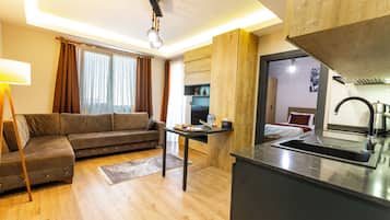 Family Suite, 2 Bedrooms | Living area | 60-inch Smart TV with satellite channels, Netflix, streaming services