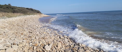 On the beach, sun-loungers