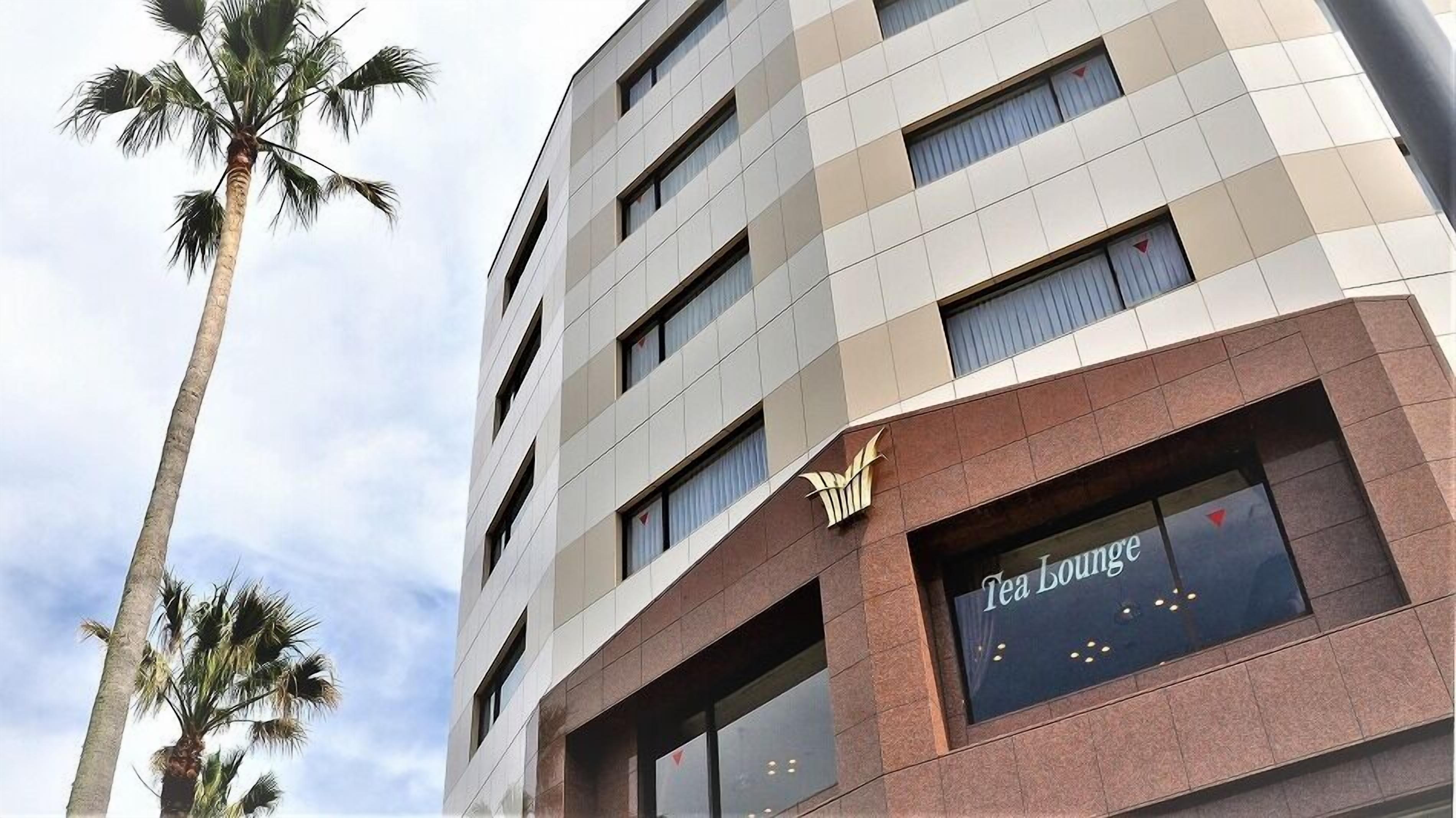 A multi-story building with a Tea Lounge on the ground floor.