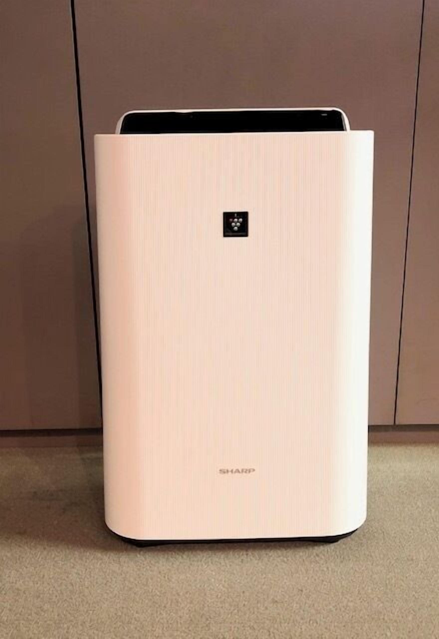 A white, rectangular, modern device with a small logo on the top and the word 'SHARP' on the bottom.