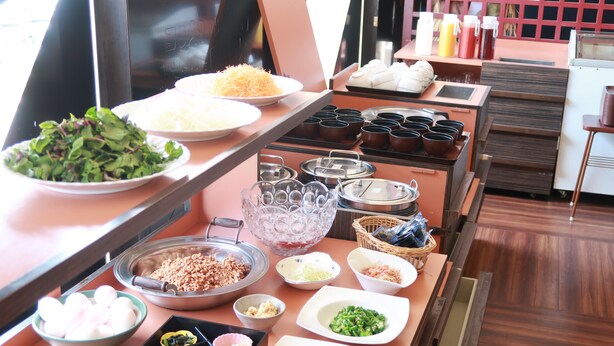 A buffet setup with various dishes and condiments. - Annex Hotel Mimatsu (Mito)