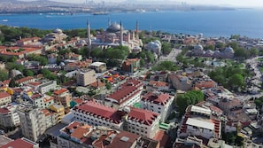 An aerial view of a historic city with prominent domed buildings and a waterfront. - Sura Luxury Million & Spa (Istanbul)