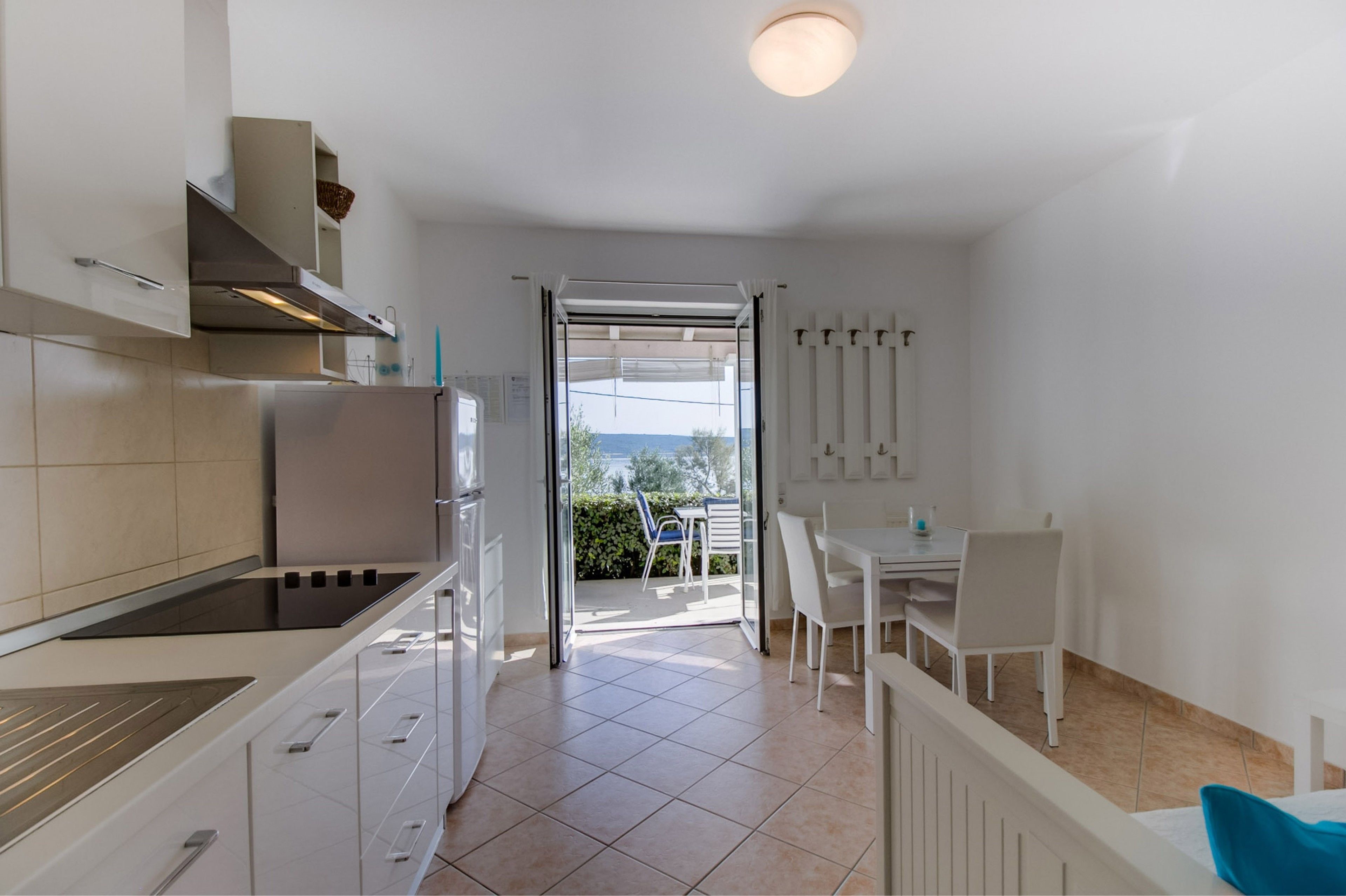 Apartment Del Sole Links | Private kitchen | Full-size fridge, stovetop, dishwasher, coffee/tea maker