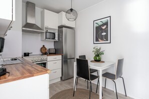 City Apartment, Balcony, City View | Private kitchen | Full-sized fridge, microwave, oven, stovetop