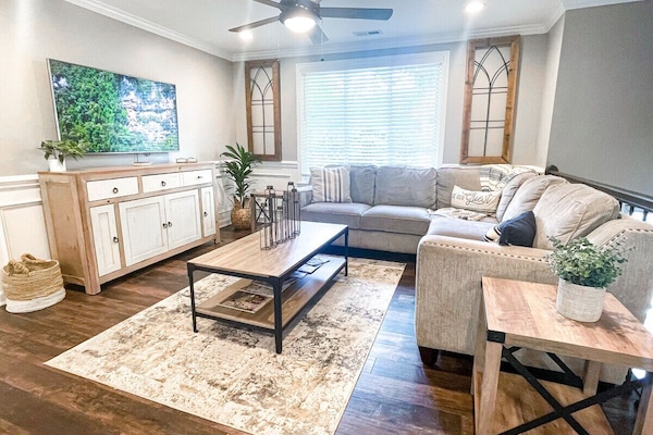 Living Room With Comfy Sectional Makes for the Perfect Place to Watch a Movie.