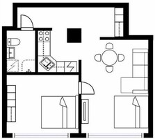 A floor plan of a hotel room with a bed, a desk, a chair, a wardrobe, and a bathroom.