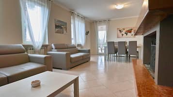 Villa, Multiple Beds | Living area | Flat-screen TV, fireplace