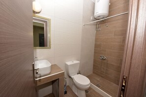 Bathtub, hair dryer, towels, soap