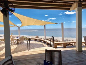 A wooden deck with a view of the beach and ocean. - Charming 2BR/2BA Villa With Golf Course View!  NO pets (Johns Island)