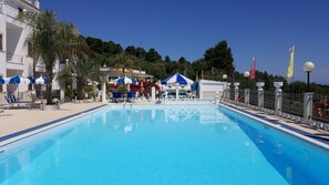 Outdoor pool, pool umbrellas, sun loungers