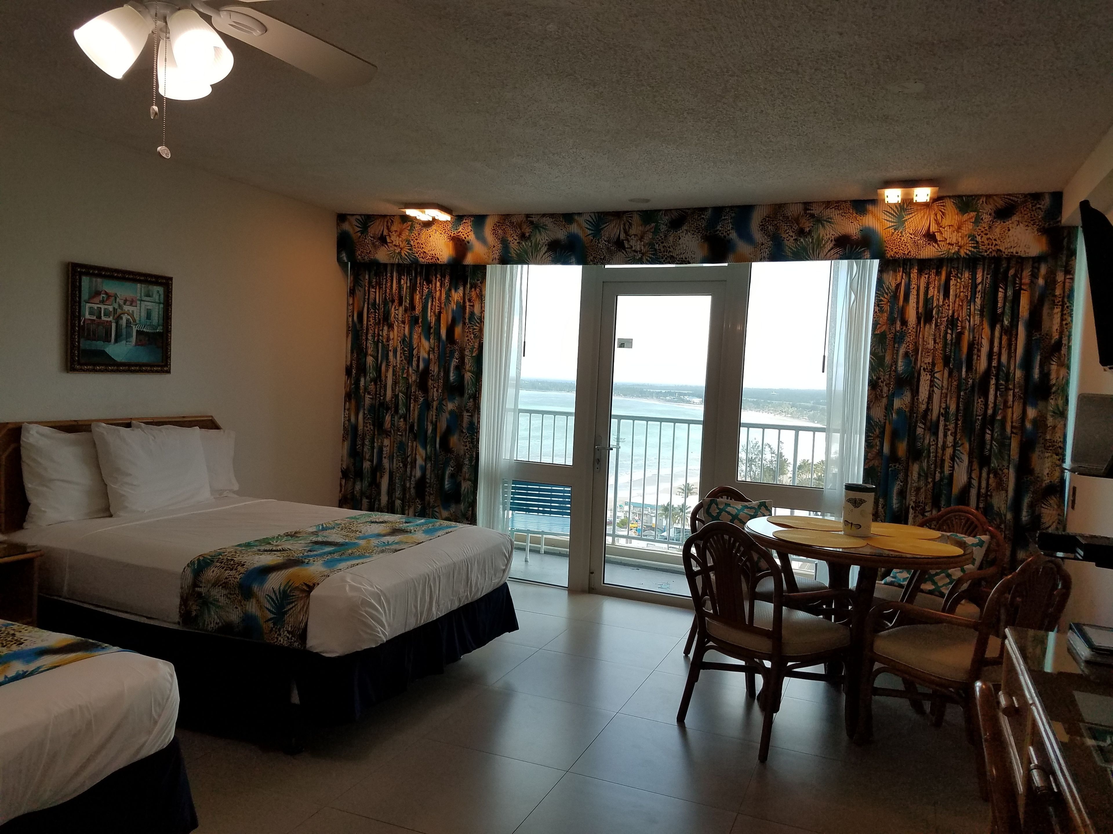 studio, 2 double beds, ocean view | living area | 40-inch smart tv with cable channels, tv