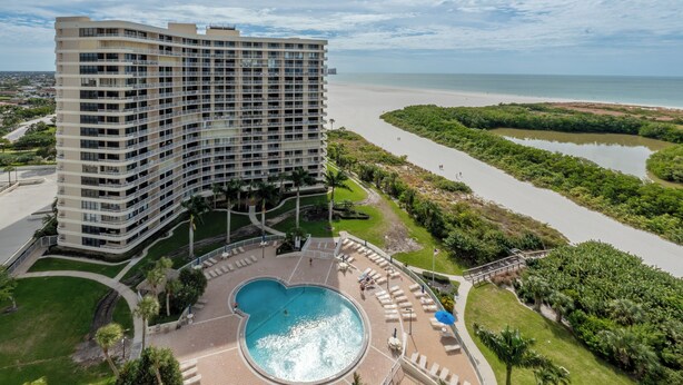 A high-rise hotel with a pool and a view of the beach and water. - Spectacular Gulf views- South Seas Tower 4-1607 (Marco Island)