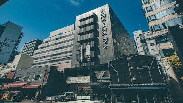 A modern building with a prominent sign reading 'KREPTAKE 27' and a visible entrance. - Kuretake Inn Osaka Midosuji Honmachi (Osaka)