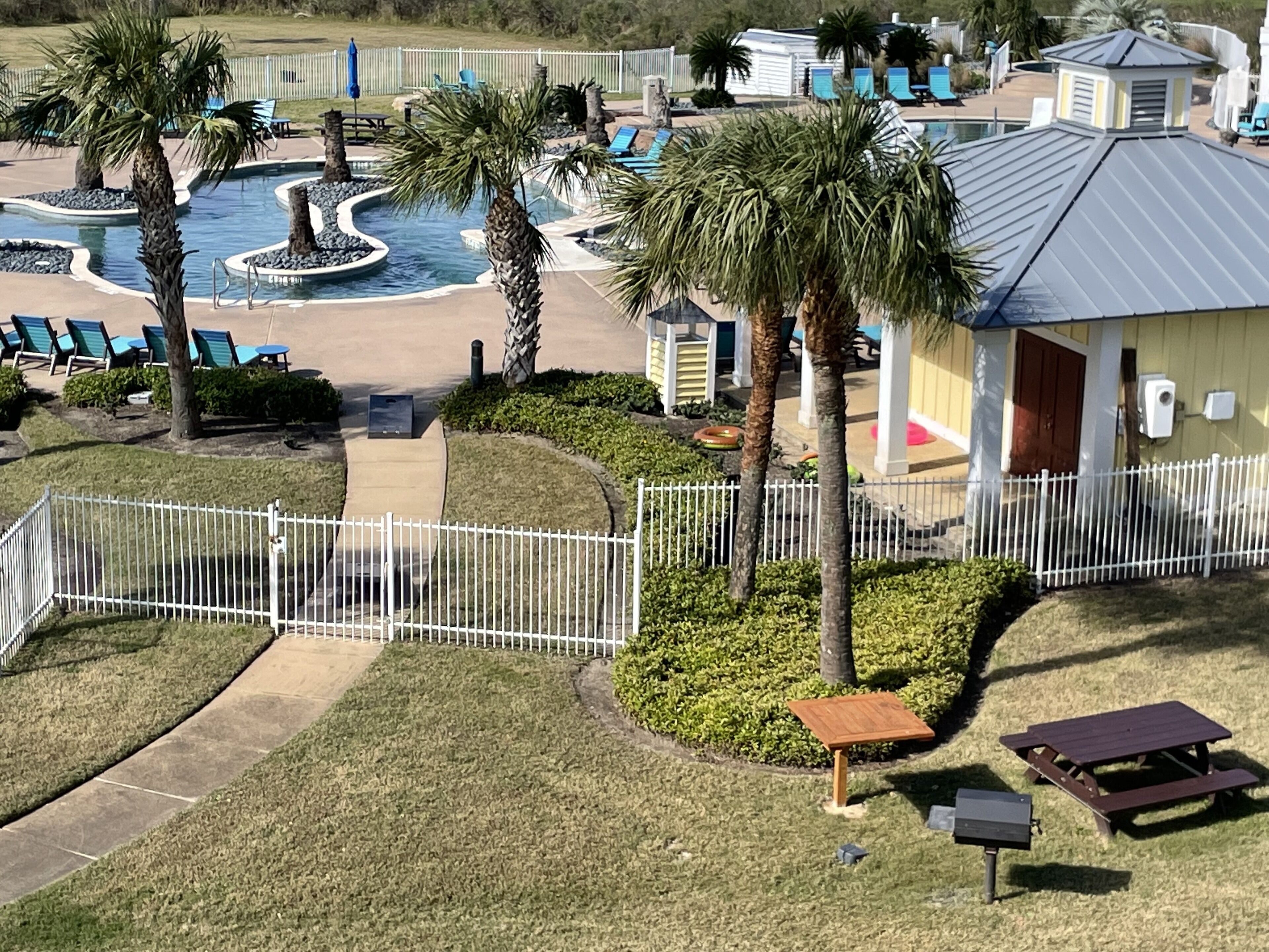 Directly below unit is a charcoal grill and picnic table to enjoy during stay.