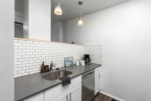 City Apartment, 2 Bedrooms, Non Smoking, Kitchen | Private kitchen | Full-sized fridge, microwave, oven, stovetop - Apts at S 8th by NamaStay (St. Louis)