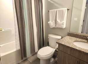 Combined shower/bathtub, hair dryer, towels, soap - Heart of the Arts District King Bed Suite - West Broad near VCU/MCV New Condo (Richmond)