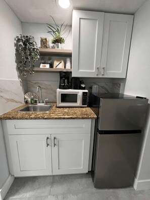 Fridge, microwave, coffee/tea maker, toaster