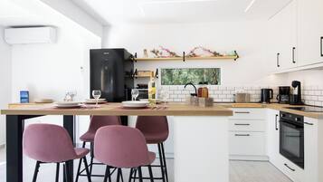 Apartment, 1 Bedroom, Patio | Private kitchen | Full-size fridge, microwave, stovetop, coffee/tea maker