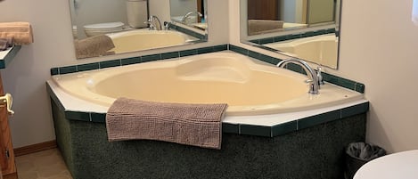 Combined shower/tub, hair dryer, towels, soap