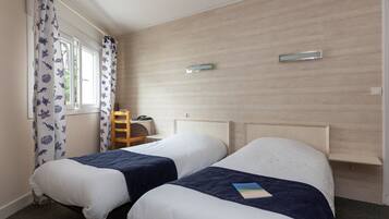 Blackout curtains, soundproofing, free WiFi, bed sheets